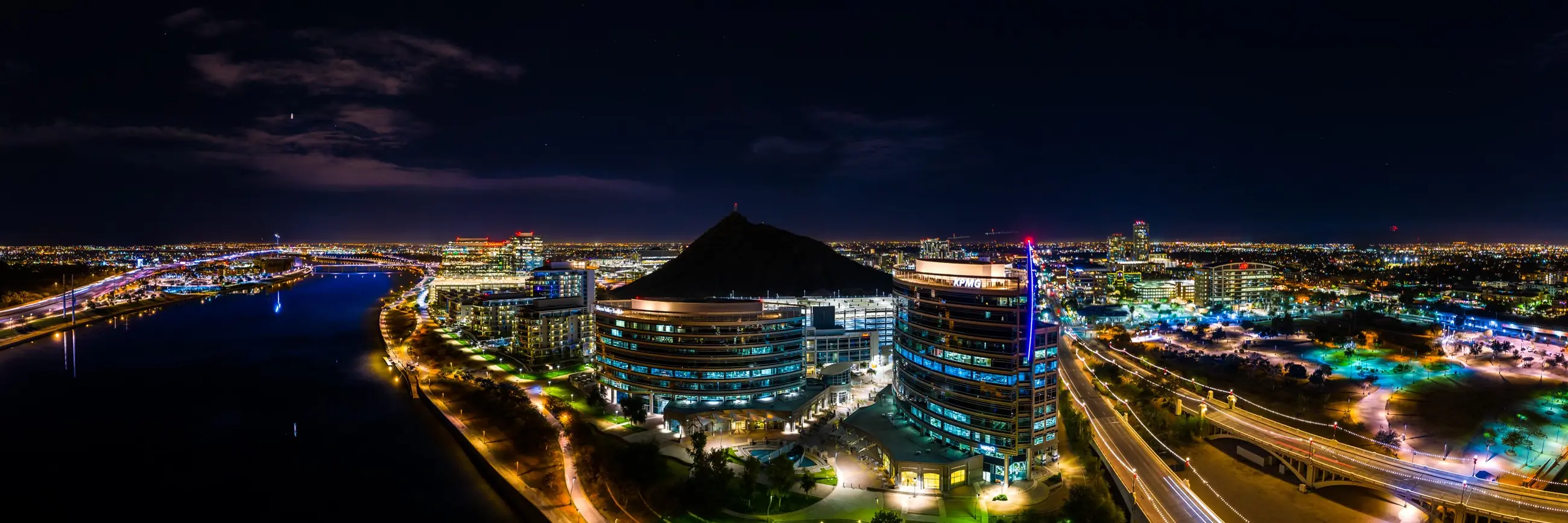 Aerial panorama of Tempe, Arizona at night over Tempe Town Lake